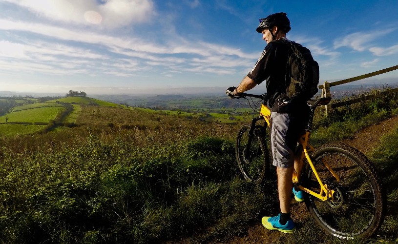 Person on bike looking at view of countryside